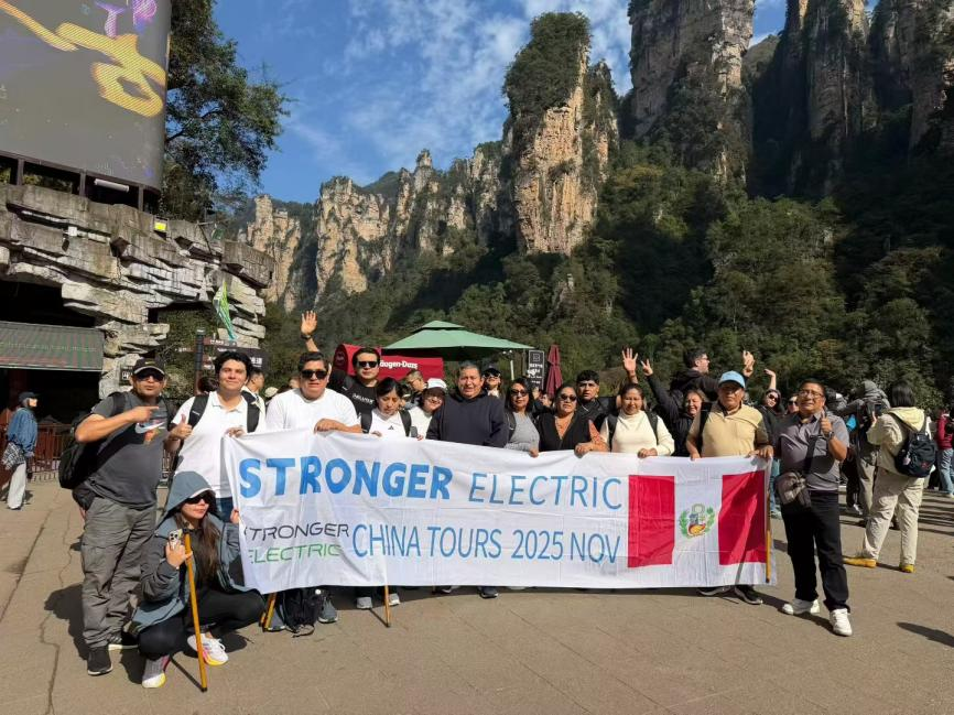 A happy tour group in front of a Chinese landmark